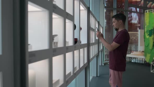 Man Is Photographing By Smartphone Inside Museum