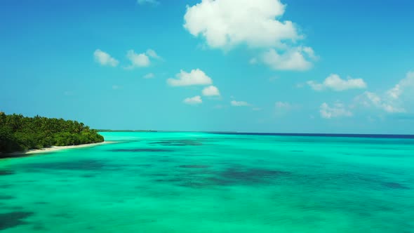 Wide overhead abstract shot of a summer white paradise sand beach and aqua blue ocean background in 