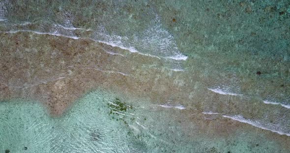 Tropical above abstract view of a summer white paradise sand beach and aqua blue water background in