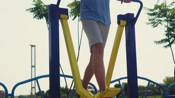 A Teenager Does Sports on the Playground