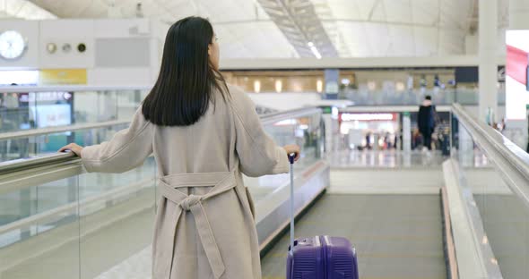 Woman go for the trip in the airport