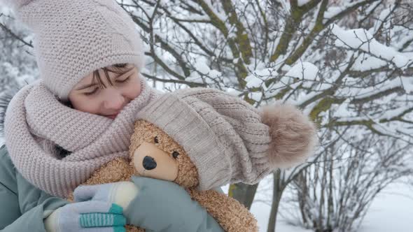Hugs Teddy Bear in Winter