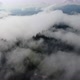 Slowly 180° over fog in mountains. Drone fly - VideoHive Item for Sale