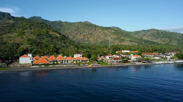 Fly Along Black Sand Beach with Volcano Mountains