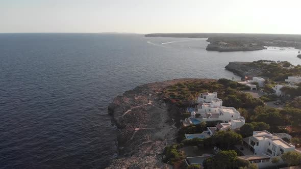 AERIAL: Beautiful coast of Cala Dor with luxury pool houses in Mallorca