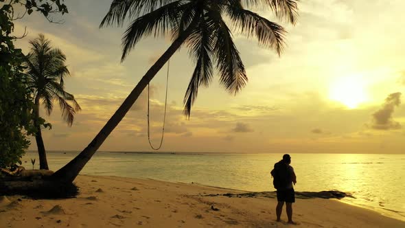 Single female tans on marine lagoon beach lifestyle by blue sea with white sandy background of the M