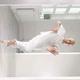 Young Man Performs Elements of Modern Dance From a White Studio - VideoHive Item for Sale