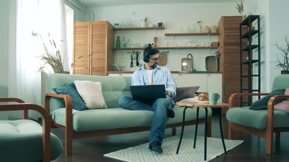 A Businessman Works From Home While on Quarantine, Using a Laptop