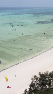 Tanzania  Vertical Video Kitesurfing Near the Shore of Zanzibar Slow Motion