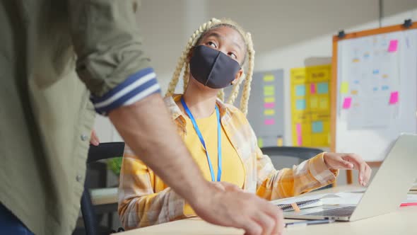 Young creative designer agency in protective face mask for protect pandemic virus