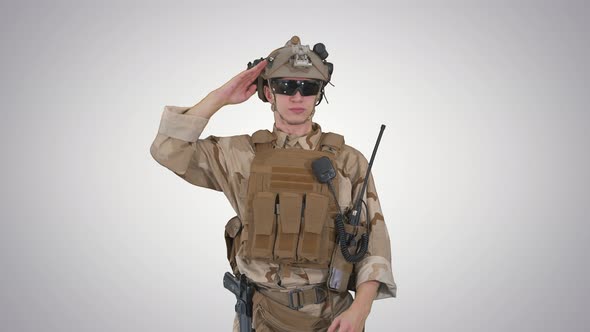 Soldier Ranger in Ammunition Saluting on Gradient Background.