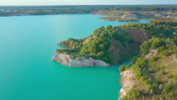 An artificial lake in chalk quarry. view from drone. Turquoise water background