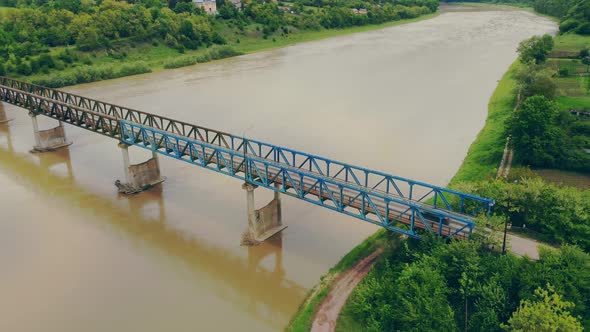 Emergency Bridge That Passes One Car. The Car Moves Across the Bridge Over a Crowded River During