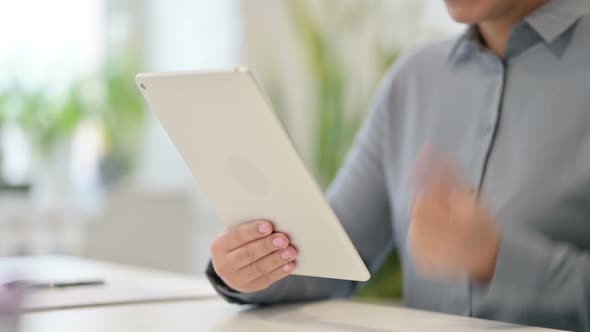 Close Up of African Woman Feeling Frustrated While Using Tablet