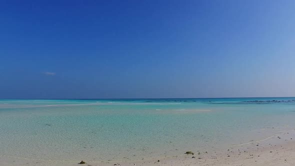 Summer tourism of tropical coastline beach break by blue sea and sand background near reef