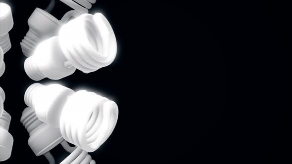 Monochrome abstract motion of shining halogen bulbs