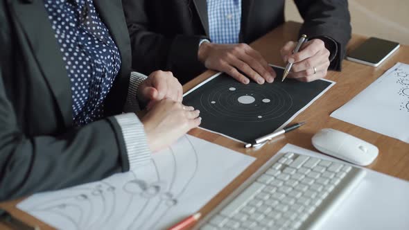 A Team of Engineers Discussing a Flight Into Space