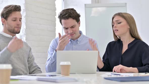 Hardworking Creative Team Reacting To Failure on Laptop