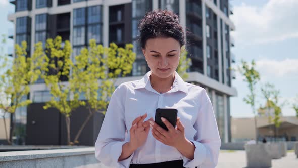 Business Woman Using Modern Mobile Device Outdoor
