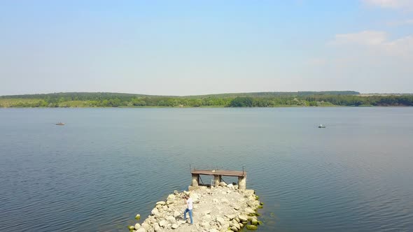 Male Photographer Near the Lake