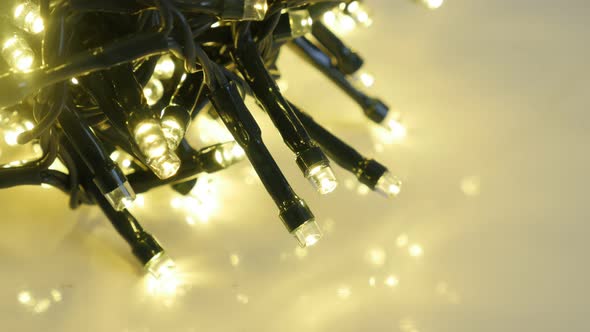 Blinking Christmas decoration  close-up 4K 2160p 30fps UltraHD footage - String with  sparkling fair