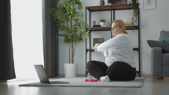 Woman Using Laptop for Sport