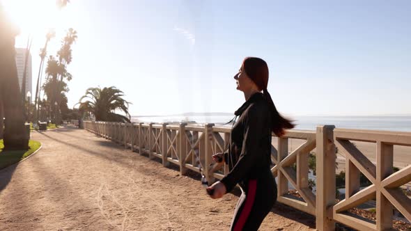 Mature Woman Exercising At The  Beach