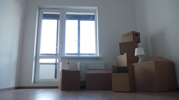 Stack of Cardboard Boxes for Moving in Interior Apartment, Movement or Real Estate Concept