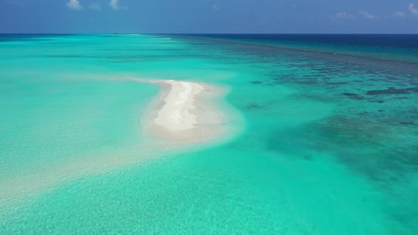 Aerial above landscape of relaxing seashore beach vacation by blue ocean and white sand background o