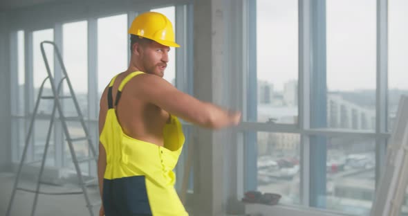 Sexy Young Shirtless Builder in Overall and Hardhat Dancing at Construction Site