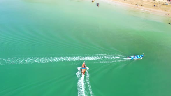 4K aerial view of drone, fishermen's boats are sailing towards the shore.