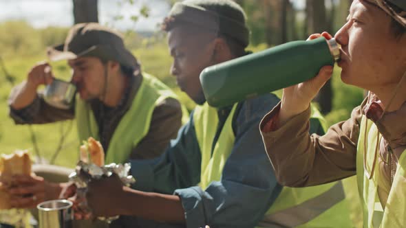 Farmers Snacking in Forest