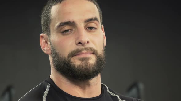 Close Up Shot of Tired Young Man Looking at Camera, Blinking