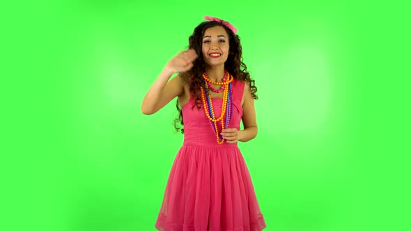 Woman Waving Hand and Showing Gesture Come Here. Green Screen