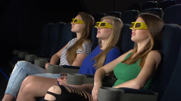 Young Friends Watching a Film at the Cinema, 3d Glasses