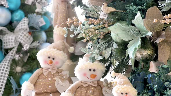 Decorated Christmas trees and snowmen in details. Panoramic plane