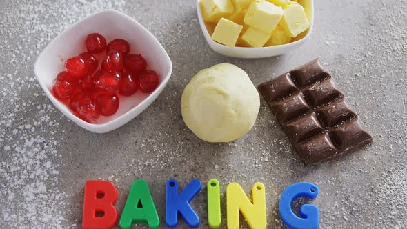 Various baking ingredients and alphabet forming baking is fun 4k