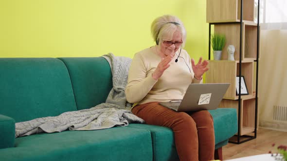 Happy Charismatic Old Woman Using Laptop to