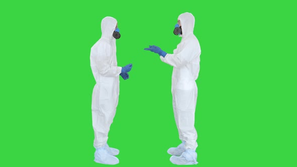 Two Doctors Giving High Five After a Successful Talk on a Green Screen, Chroma Key.