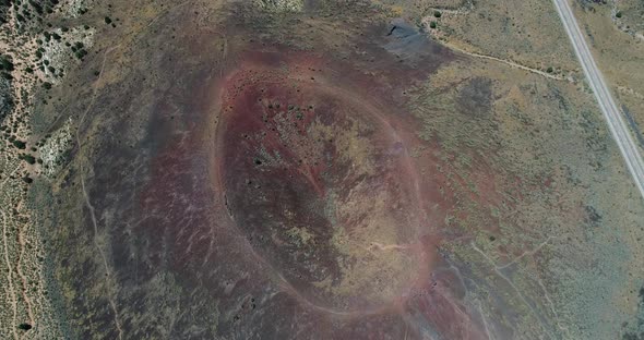 Aerial video flying over the Santa Clara volcano crater in Snow Canyon State Park, Utah