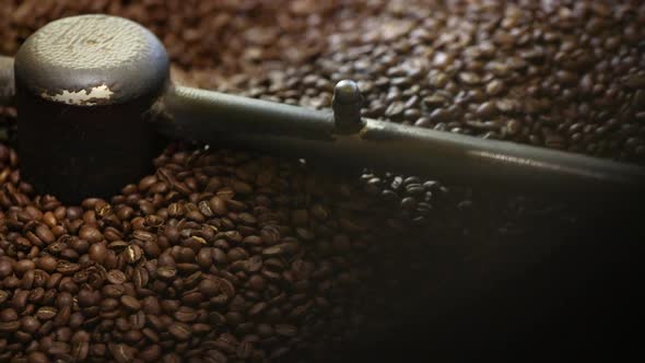 Coffee Production. Brown Beans Roasting In Machine Closeup