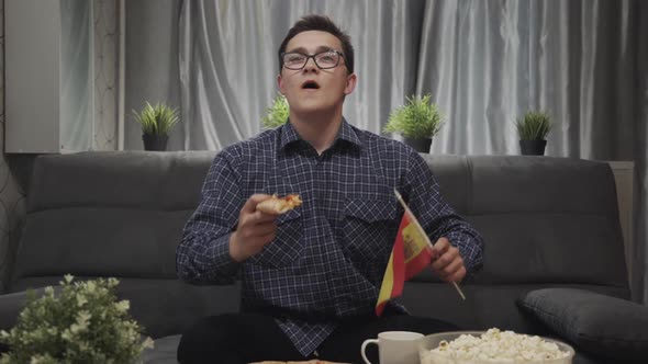 Boy Fan Watching Tv, Rooting for Favorite Sports Team Spain Losing in Championship. Man on Couch in