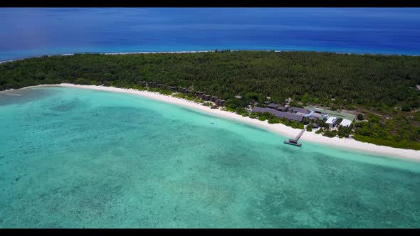 Aerial top down travel of luxury bay beach break by blue water with white sandy background of a dayo