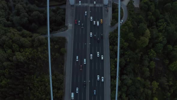 Cars Driving Onto Bridge Towards City Skyline in Istanbul, Turkey Over Bosphorus, Aerial Birds Eye