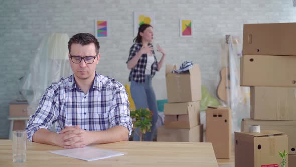 Woman and Man Couple Breakup or Divorce Boxes To Move Packing for the Move