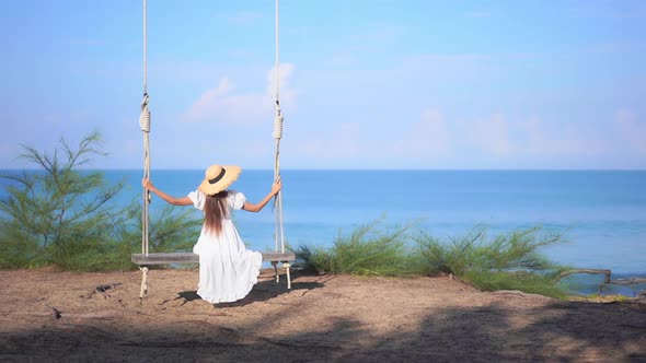 Asian woman enjoy around beautiful beach sea ocean