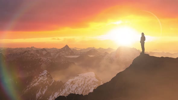 Magical Fantasy Adventure Composite of Man Hiking on Top of a Rocky Mountain