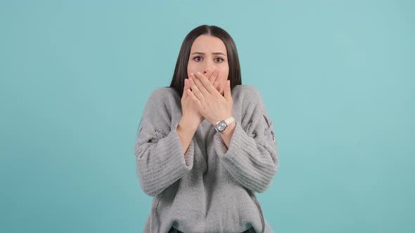 Close Up of an Young Woman Looking Excited Holding Her Mouth Opened.