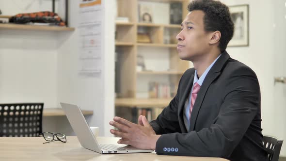 Pensive African Businessman Thinking at Work