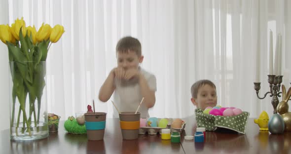 Two Boy Friends Jump Like Rabbits After Painting Easter Eggs